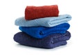 Stack of clean coloful soft towels on white background