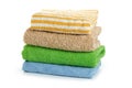 Stack of clean coloful soft towels on white background