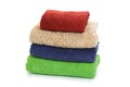 Stack of clean coloful soft towels on white background