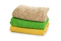 Stack of clean coloful soft towels on white background