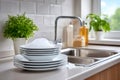 Stack of clean dishes with soap foam in kitchen Royalty Free Stock Photo