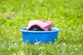 Stack of clean laundry in plastic cup outdoors Royalty Free Stock Photo