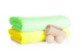 Stack of clean soft towels, bath bombs and sponge