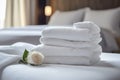 Stack of clean towels on table in hotel room. Laundry day, clean white towels on the hotel bed, feels cozy, comfortable and relax Royalty Free Stock Photo