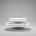 Stack of clean white ceramic dinner plates artfully arranged for a modern kitchen aesthetic Royalty Free Stock Photo
