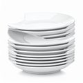 Stack of Clean White Ceramic Plates on White Background Royalty Free Stock Photo