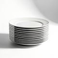Stack of clean white dinner plates ready for your next meal white background Royalty Free Stock Photo