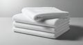 Stack of Clean White Folded Fabric Sheets on a Light Gray Surface Royalty Free Stock Photo