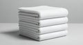 Stack of Clean White Folded Towels on a Light Gray Surface Royalty Free Stock Photo