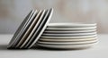 Stack of clean white and gray ceramic plates arranged in two groups Keywords: plates, ceramic Royalty Free Stock Photo