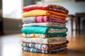 stack of cloth diapers in various colors and patterns