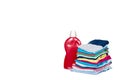 Stack of clothes and detergent bottle, fresh laundry textile Royalty Free Stock Photo