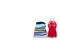 Stack of clothes and detergent bottle, fresh laundry textile Royalty Free Stock Photo