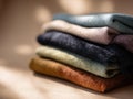 A stack of clothes in different colors. Generative AI. Royalty Free Stock Photo