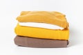 A stack of clothes isolated on white background close-up. Royalty Free Stock Photo