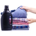 Stack clothes shirt with black bottle liquid laundry