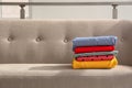 Stack of clothes on sofa Royalty Free Stock Photo