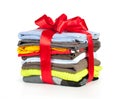 Stack of clothing with red ribbon