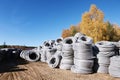 Stack of coiled plastic pvc Polyethylene Corrugated drainage pipes for sewer system outdoor warehouse