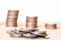 Stack coin and three pole range of coins on vintage blurred back Royalty Free Stock Photo