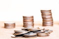 Stack coin and three pole range of coins on vintage blurred back Royalty Free Stock Photo