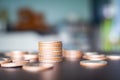 Stack coin on wooden background. pile thai cash and blur floor bank account