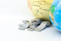 Stack of coin beside the world map. Image use for investment, business international concept