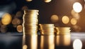 Stack of coins on black background with golden bokeh effect. Royalty Free Stock Photo