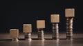 Stack of coins and empty wooden cubes on the table. Business. Finance Royalty Free Stock Photo