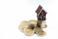 Stack of coins with mini house,Business finance, saving and home Royalty Free Stock Photo