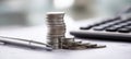 The stack of coins next to a pen and calculator on financial documents. AI generated image Royalty Free Stock Photo