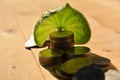 stack coins put beside leaves for save money and financial, tax Royalty Free Stock Photo