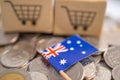 Stack of coins, shopping cart box with Australia flag, finance concept Royalty Free Stock Photo