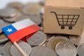 Stack of coins, shopping cart box with Chile flag, finance concept