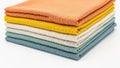 Stack of colored fabrics isolated on white background Royalty Free Stock Photo