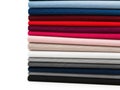Stack of colored fabrics isolated on white background Royalty Free Stock Photo