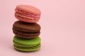 Stack of Colored macaroons or macarons on a pink background Royalty Free Stock Photo