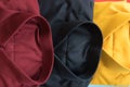 Stack of colored men shirt red,black and yellow Royalty Free Stock Photo