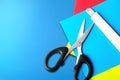 Stack of colored paper with scissors and cutter Royalty Free Stock Photo