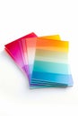 Stack of colored papers sitting on top of each other. Generative AI Royalty Free Stock Photo