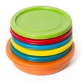 Stack of colored plastic discs with green lid isolated on transparent background Royalty Free Stock Photo