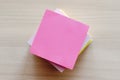 A stack of colored stickers on a neutral background. Place for text, copyspace. View from above