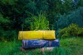 Stack of colored stone books lying on the grass Royalty Free Stock Photo