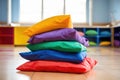 a stack of colorful bean bags in a childrens playroom