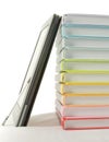 Stack of colorful books and electronic book reader Royalty Free Stock Photo