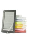 Stack of colorful books and electronic book reader