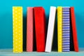 Stack of colorful books, grungy blue background, free copy space Royalty Free Stock Photo