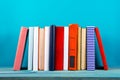 Stack of colorful books, grungy blue background, free copy space Royalty Free Stock Photo