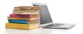 The stack of colorful books beside a modern laptop on a white surface. AI generated image Royalty Free Stock Photo