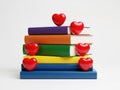 Stack of colorful books with red hearts on top isolated on transparent background Royalty Free Stock Photo